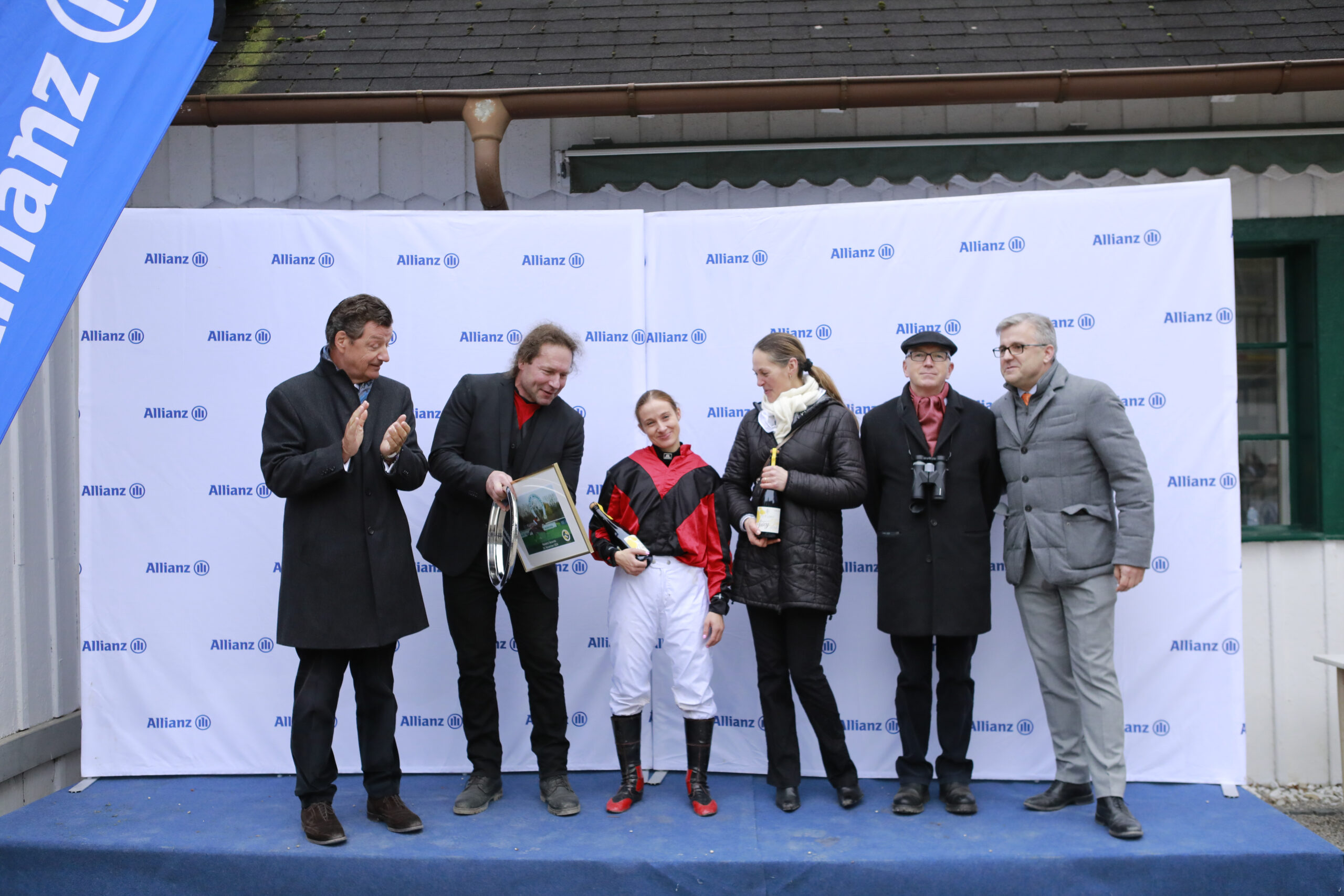 10.11.2024 - Munich; Winners presentation with Michael Motschmann (Chairman Muenchener Rennverein e.V.), Juergen Strassmeier, Elodie M.Palau Teruel, Marion Figge, Michael Figge and Sascha Multerer (General Secretary Muenchener Rennverein e.V.) after winning the Wettstar.de joins World Pool Handicap with Noreia’s Secondo at Munich-Racecourse/Germany. Credit: Lajos-Eric Balogh/turfstock.com