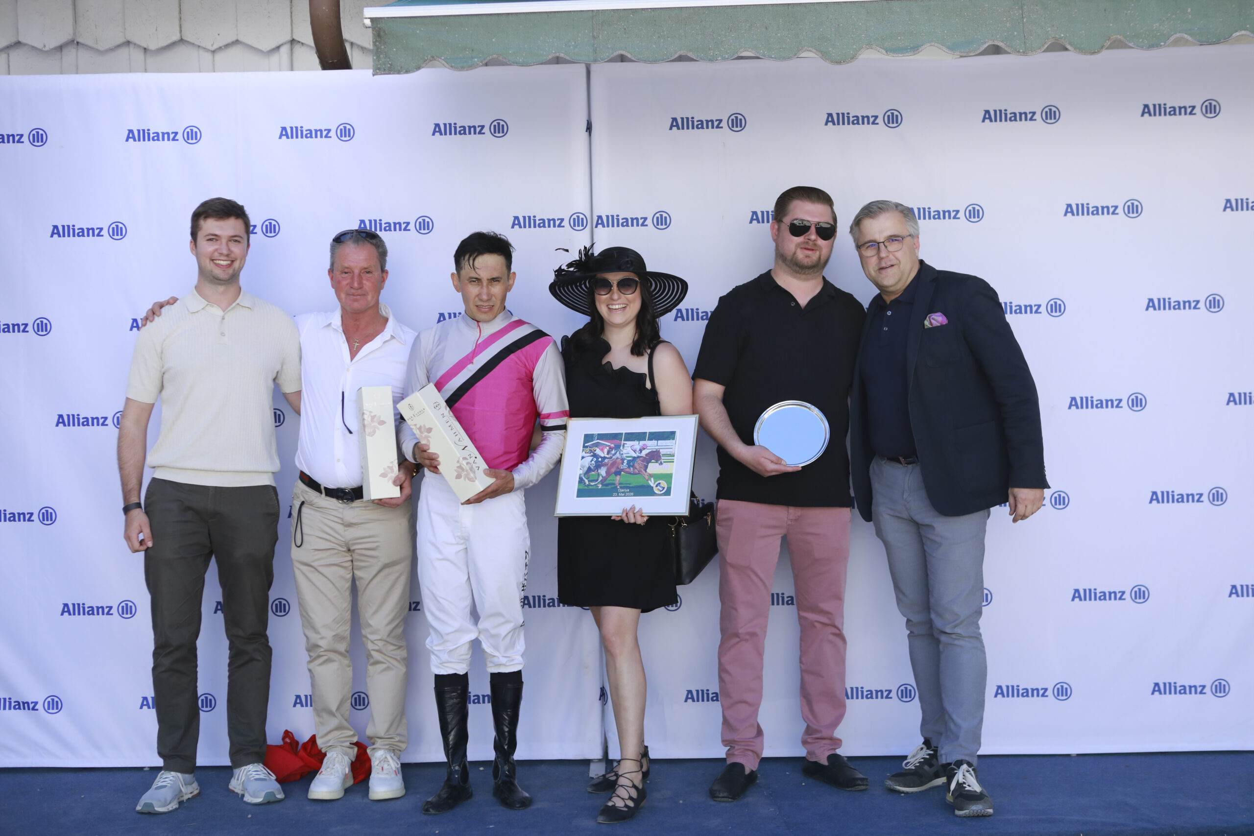 23.05.2026 - Munich; Winners presentation with Representative of the sponsor, John David Hillis, Bauyrzhan Murzabayev, Samantha Heumann, Deimi Ziese and Sascha Multerer (General Secretary Muenchener Rennverein e.V.) after winning the Paktum-Preis with Djariya at Munich-Racecourse/Germany. Credit: Lajos-Eric Balogh/turfstock.com